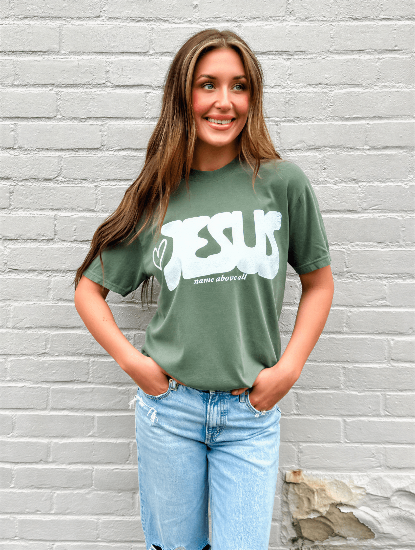 model wearing Name Above All Tee