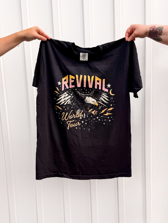 Revival World Tour Tee being held up