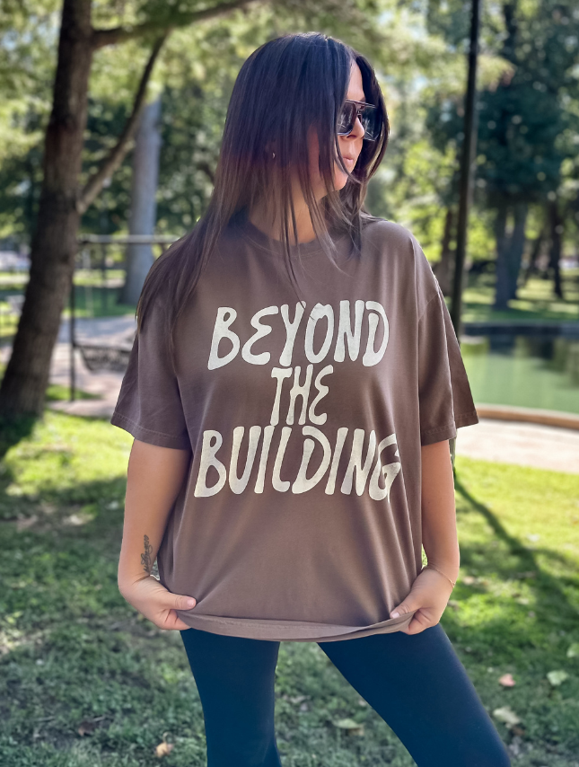 model wearing Beyond The Building Tee