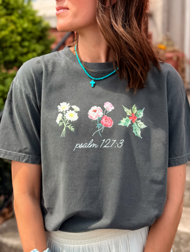 Custom birth flower tee in dark gray featuring floral designs and the text "psalm 127:3" in white.