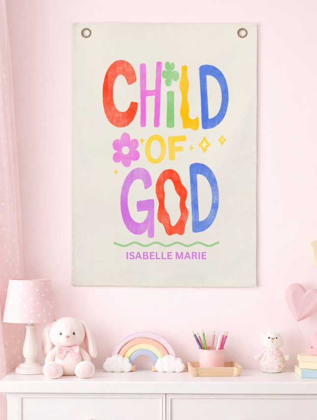 Decorative wall hanging with 'Child of God' text in a child's room.