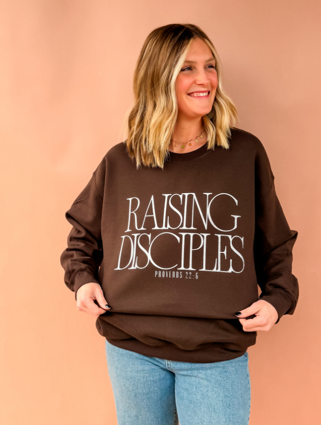 model wearing Raising Disciples Sweatshirt