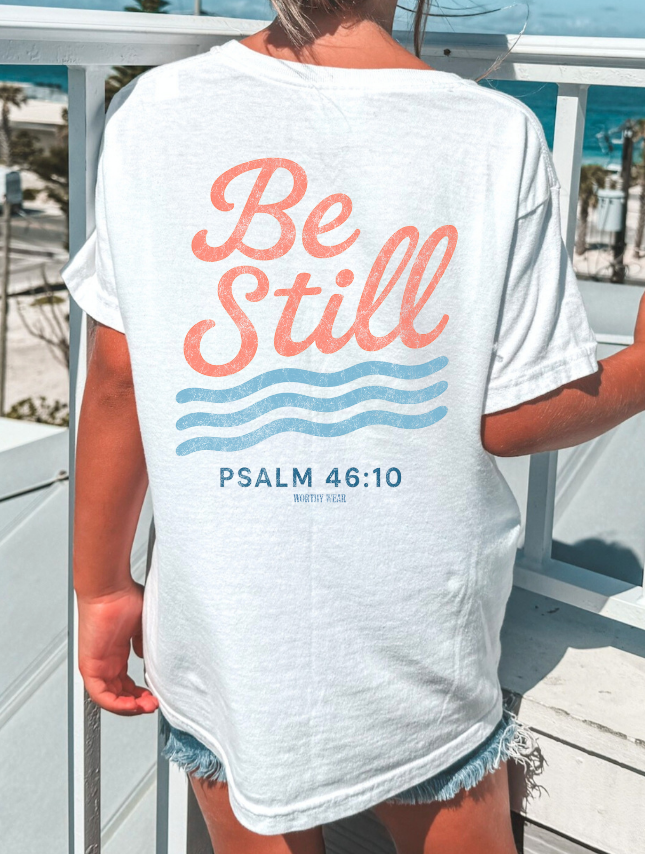 youth wearing back of youth be still tee