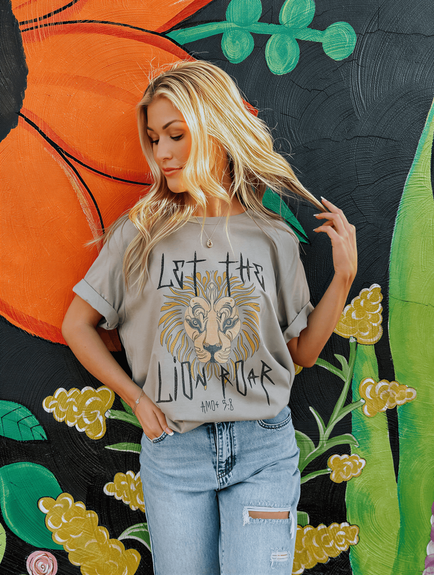 model wearing let the lion roar tee