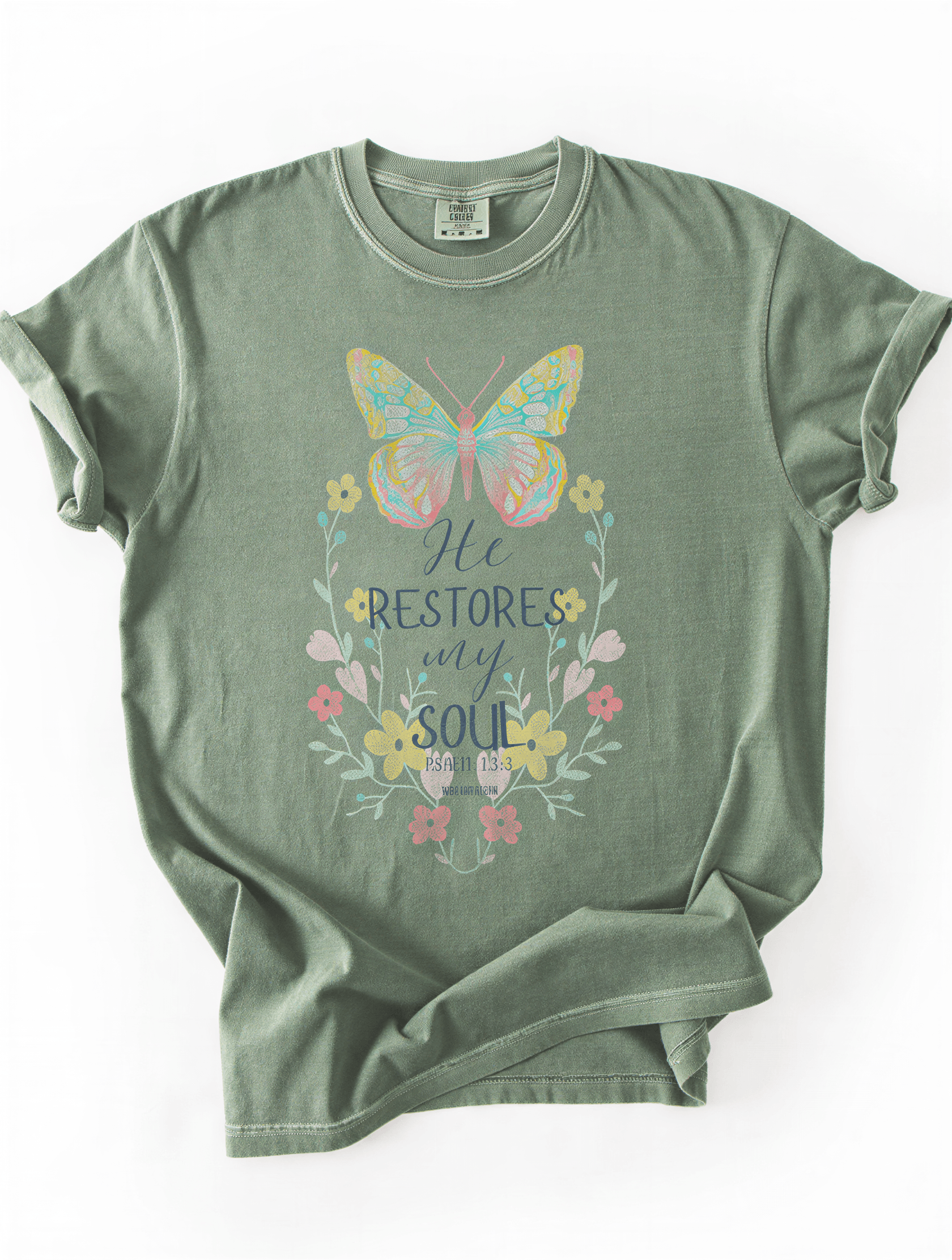 flat lay of he restores my soul tee