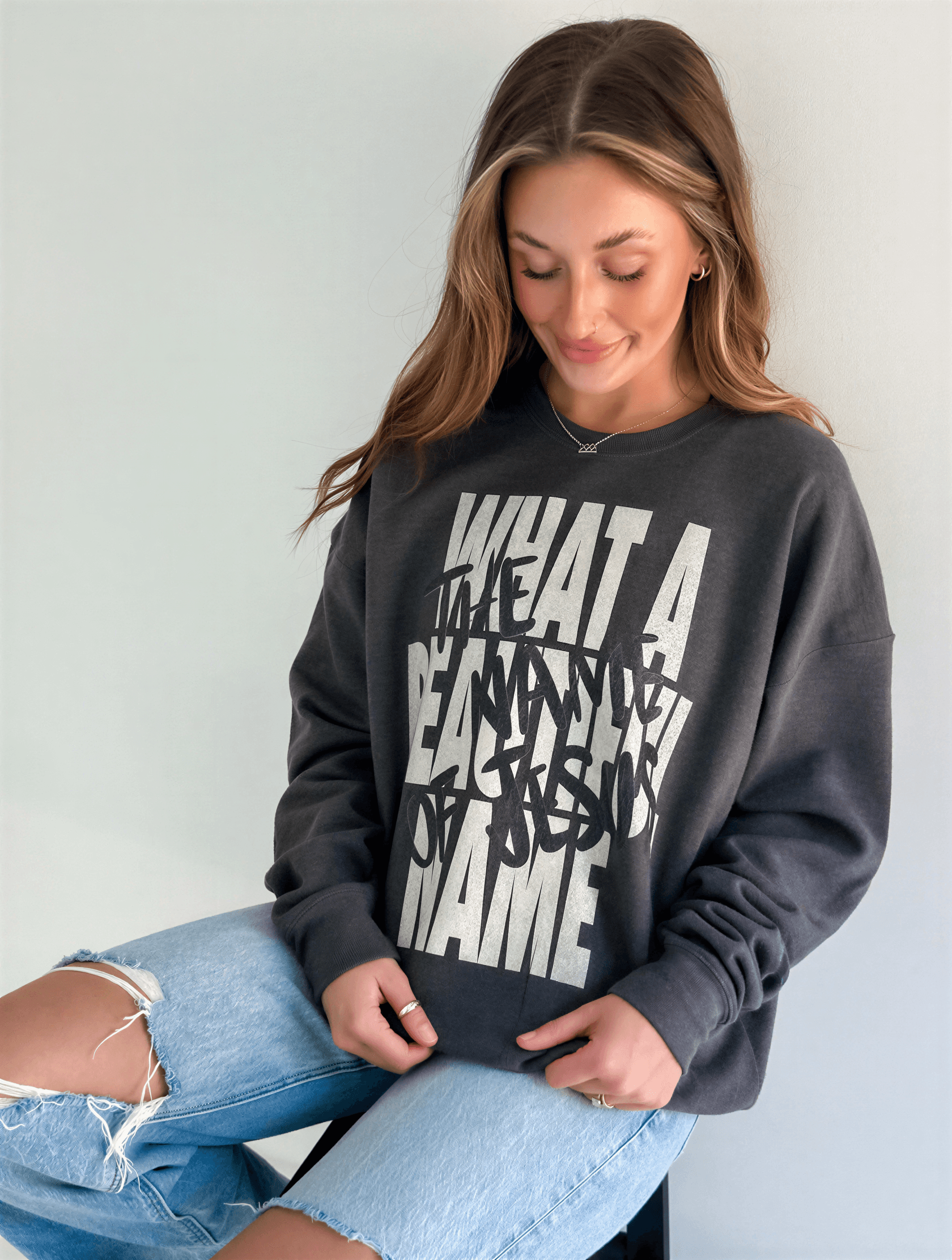 model wearing What A Beautiful Name Sweatshirt