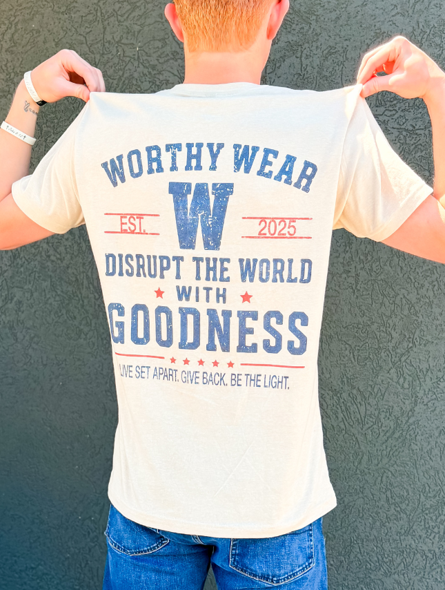 Worthy Wear vintage goodness tee in cream, featuring blue and red text on the back with a large 'W' and established date.