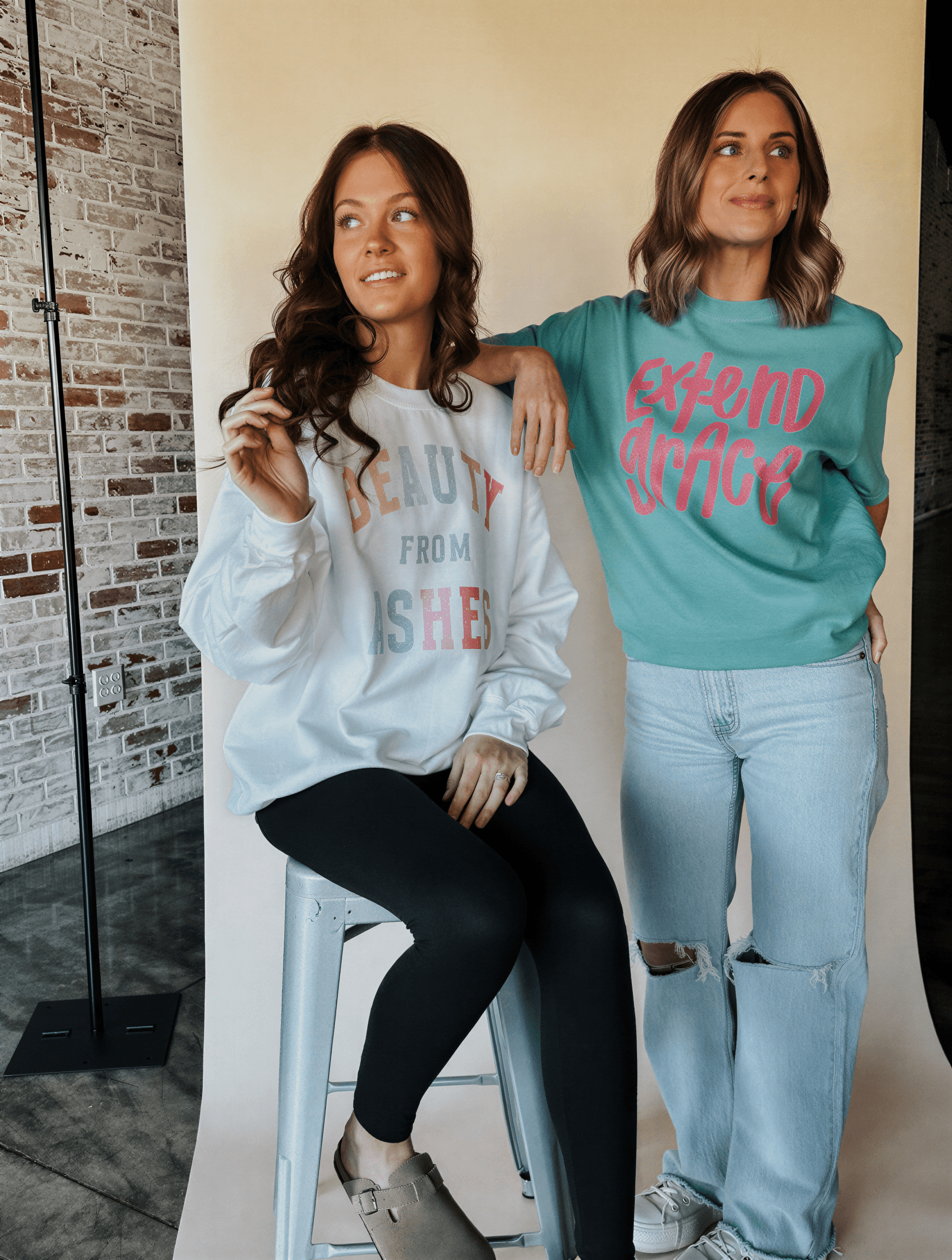 two girls wearing our shirts