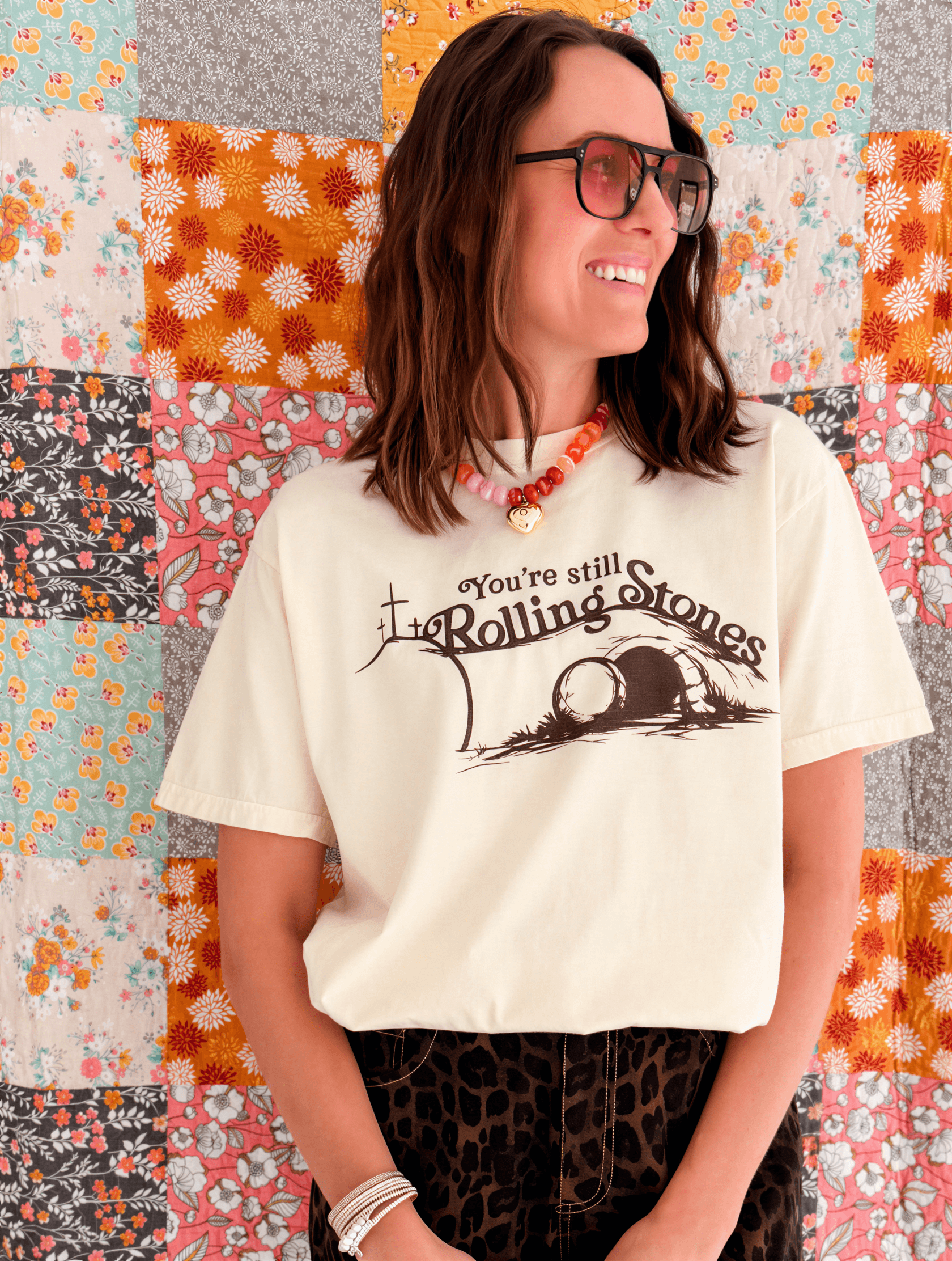 model wearing you're still rolling stones tee
