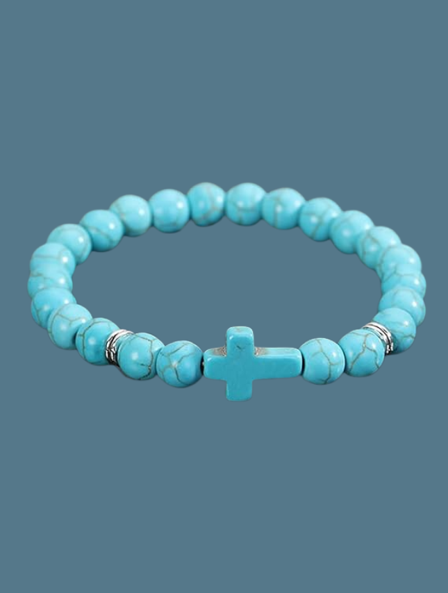 Turquoise cross stretch bracelet featuring round beads and a central cross accent.