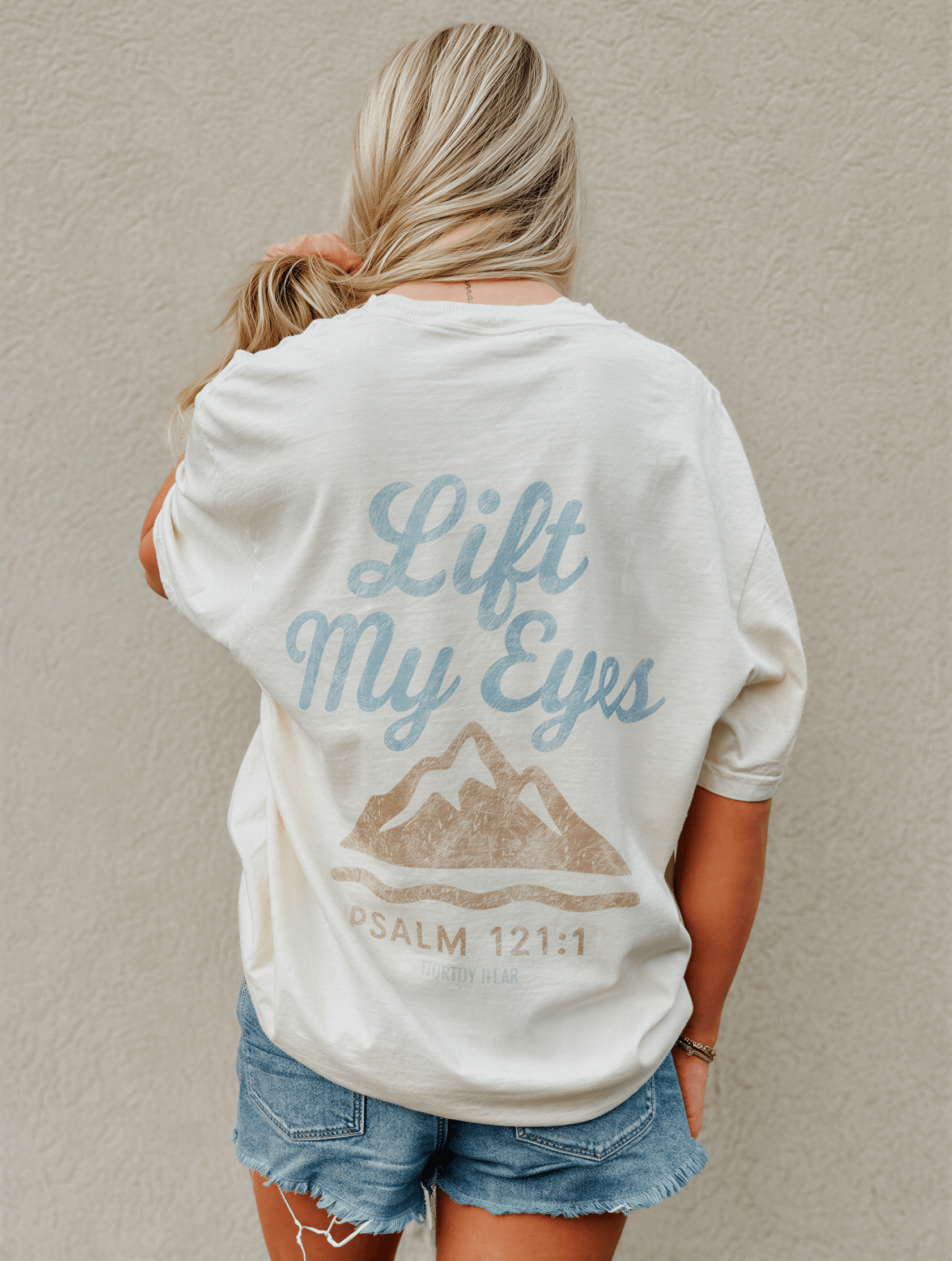 model wearing Lift My Eyes Tee