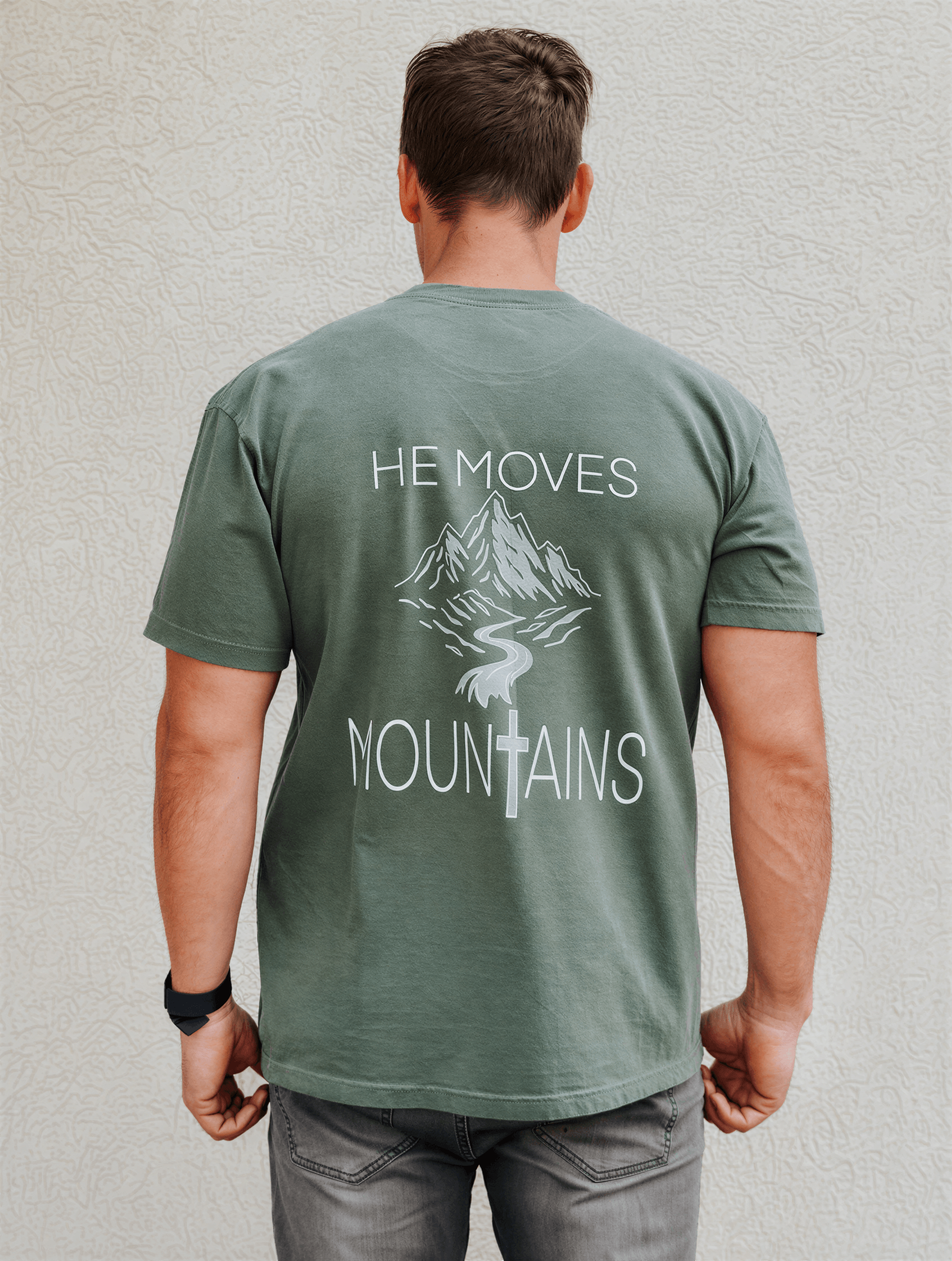 model wearing He Moves Mountains Tee