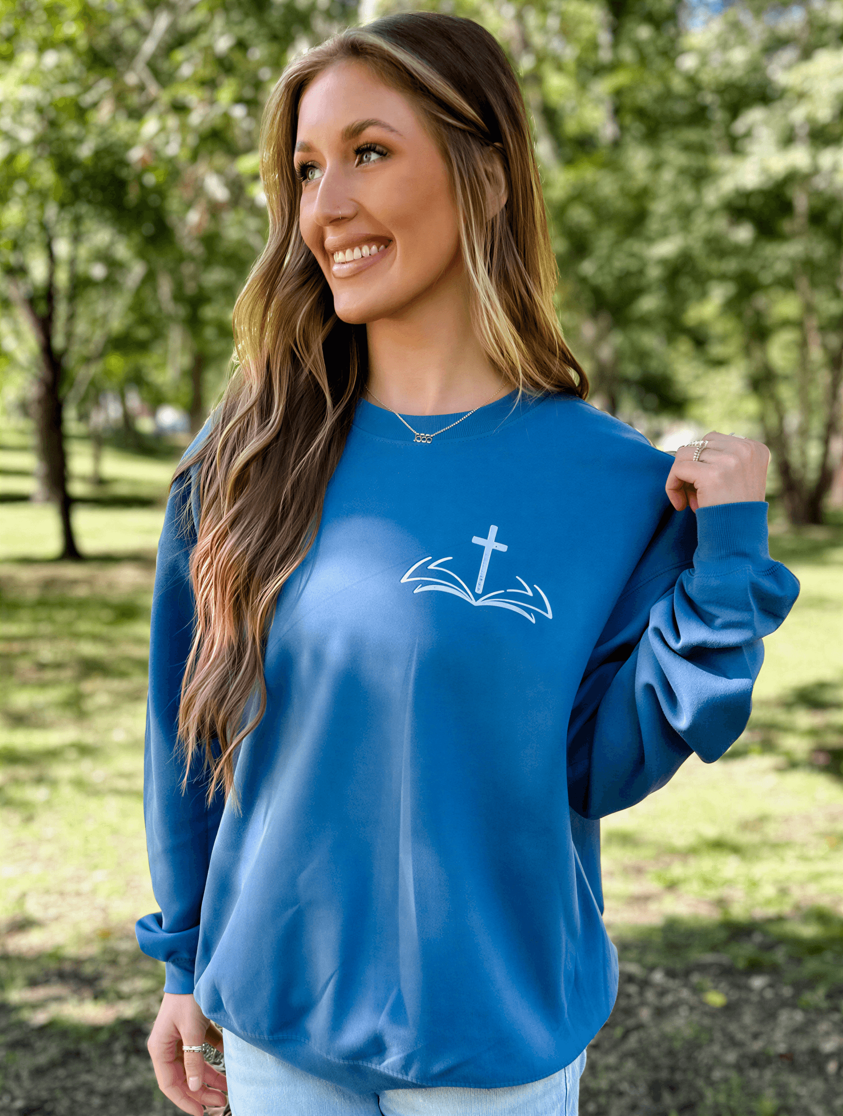 model wearing Trust Him Sweatshirt