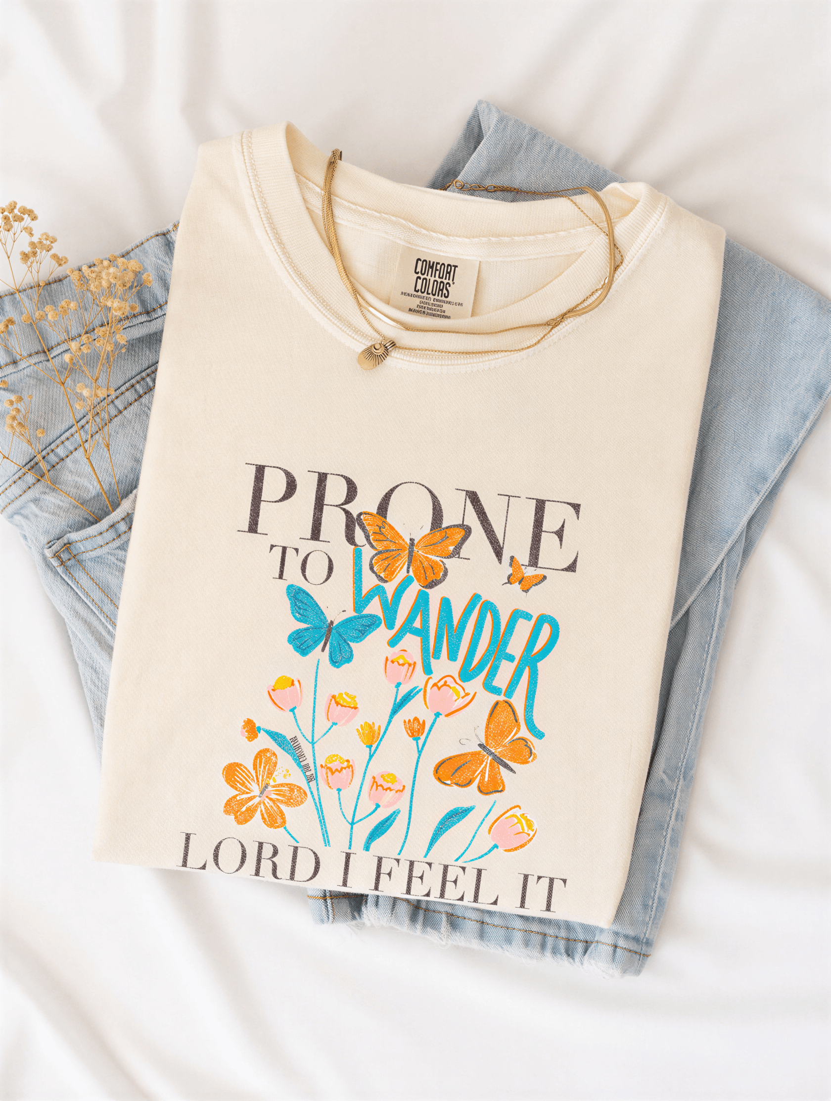 flat lay of Prone To Wander Tee