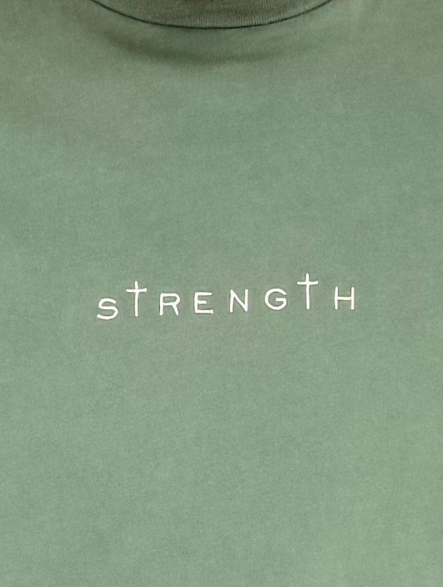 Green t-shirt with 'STRENGTH' printed on it