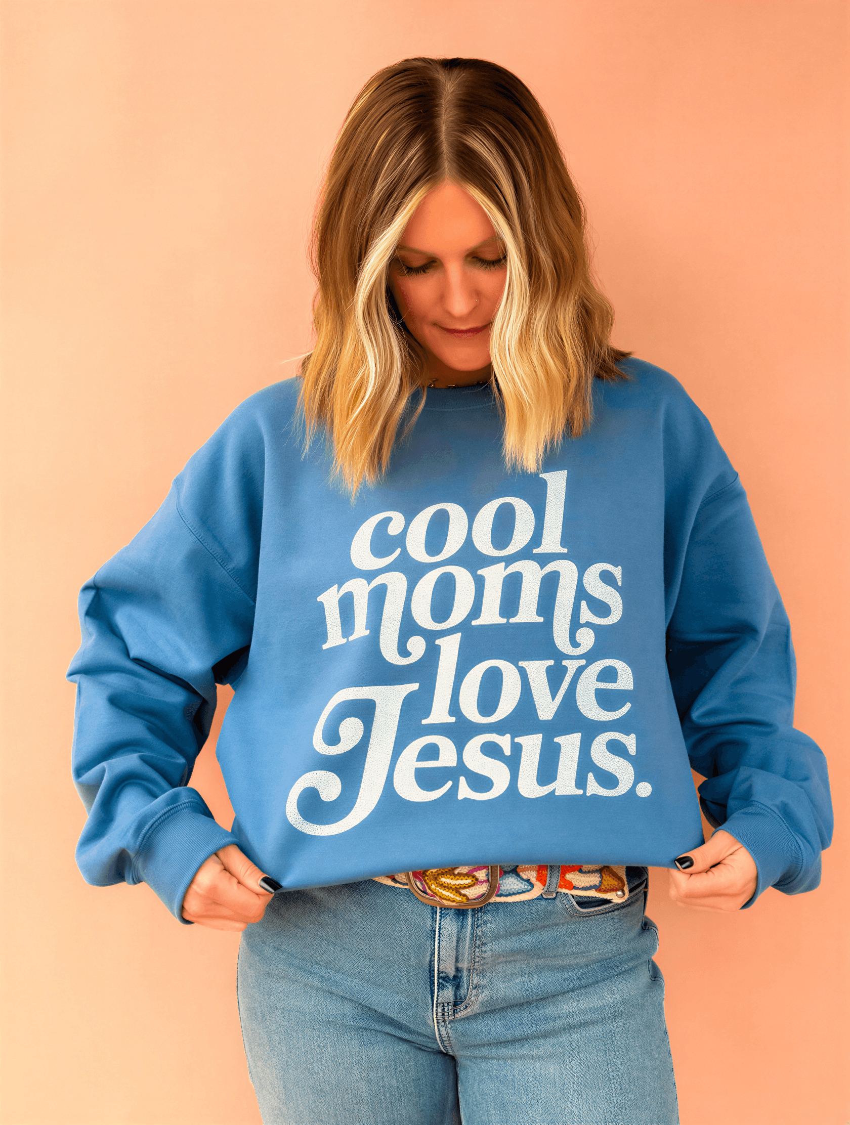 model wearing Cool Moms Love Jesus - Indigo Sweatshirt