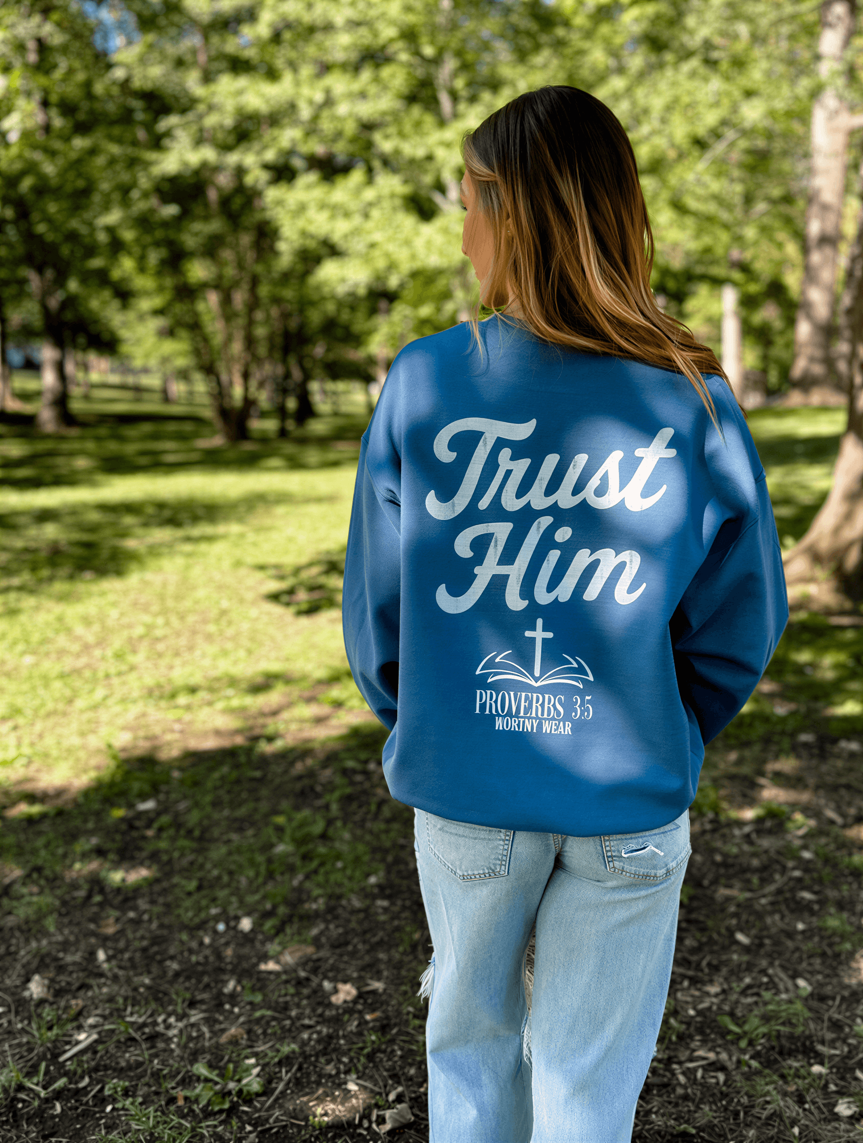 model wearing Trust Him Sweatshirt