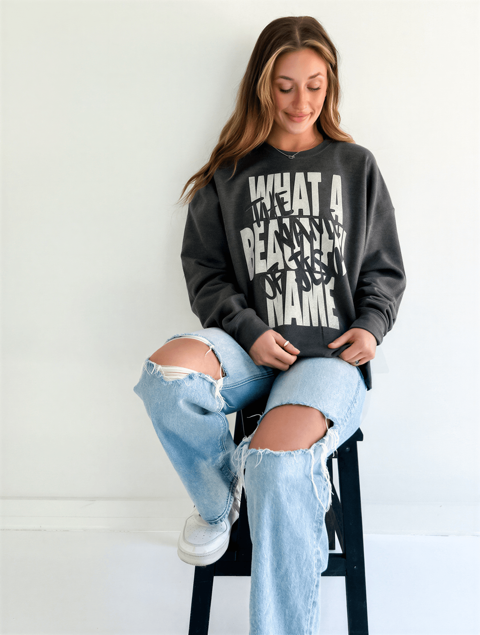 model wearing What A Beautiful Name Sweatshirt