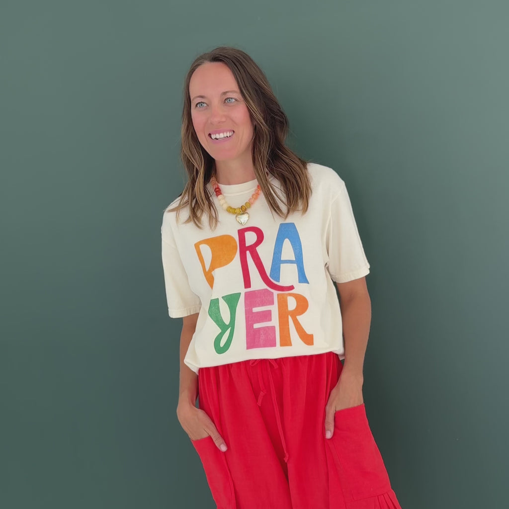 woman wearing prayer tee

