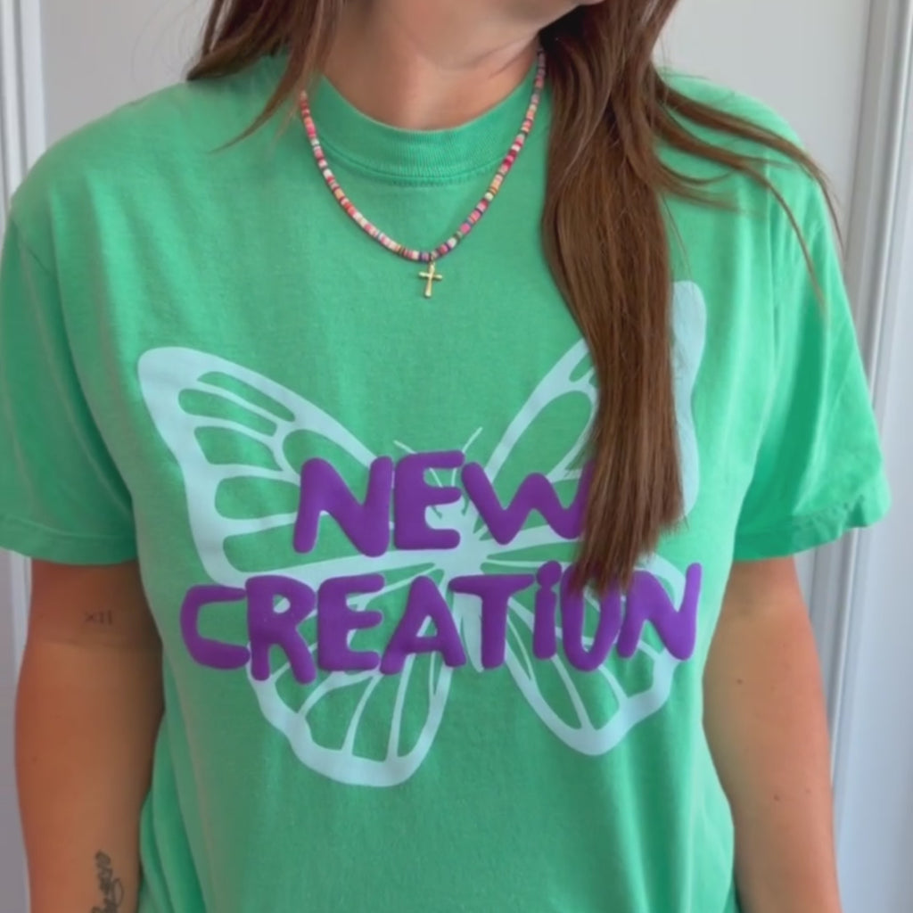 woman wearing new creation puff tee